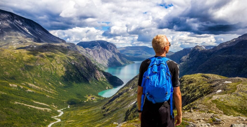A man looking at a mountain peak representing how purpose makes quitting porn easier.