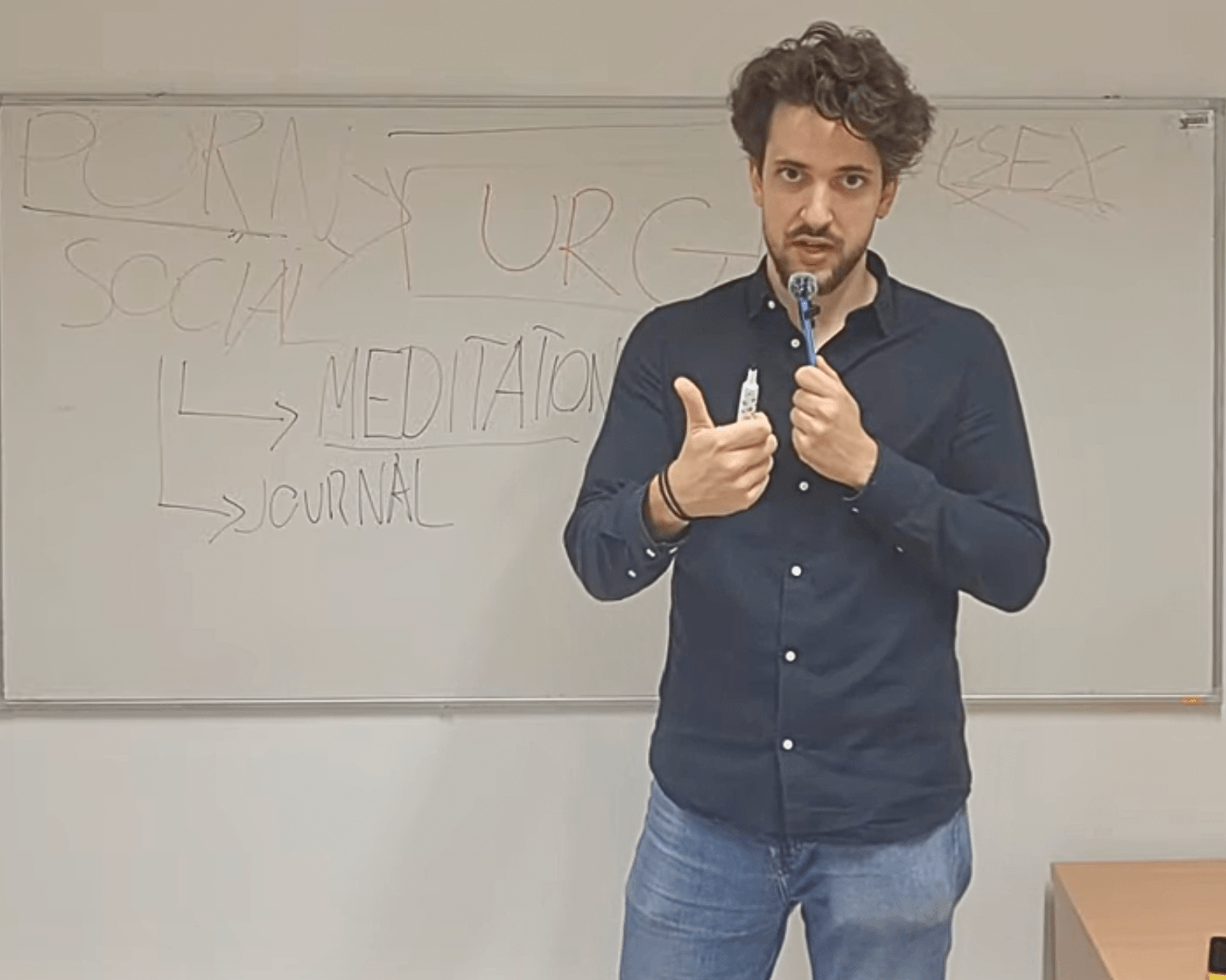 Nick Ambrus explaining a coaching concept at a whiteboard