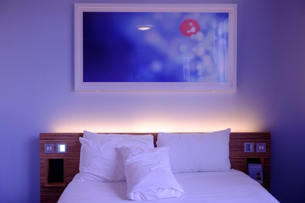 A clean, organized modern bedroom free of digital distractions, illustrating environment design for porn addiction recovery.
